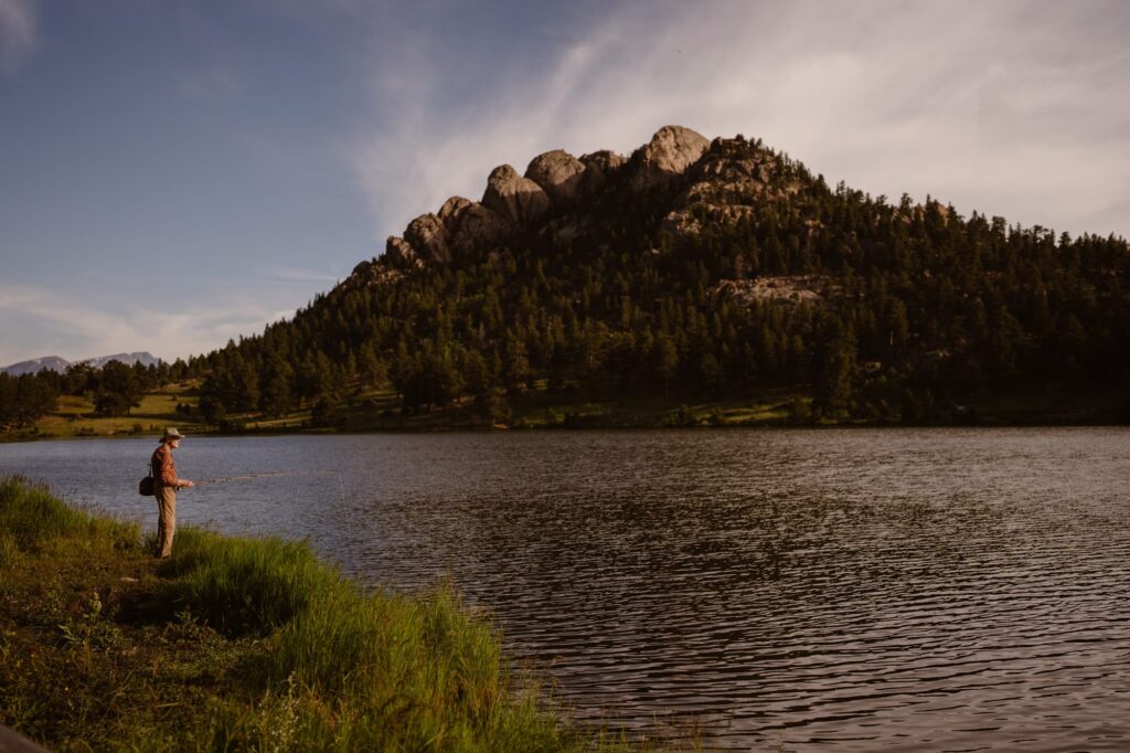 Fisherman in the morning at Lily Lake in Rocky Mountain National Park