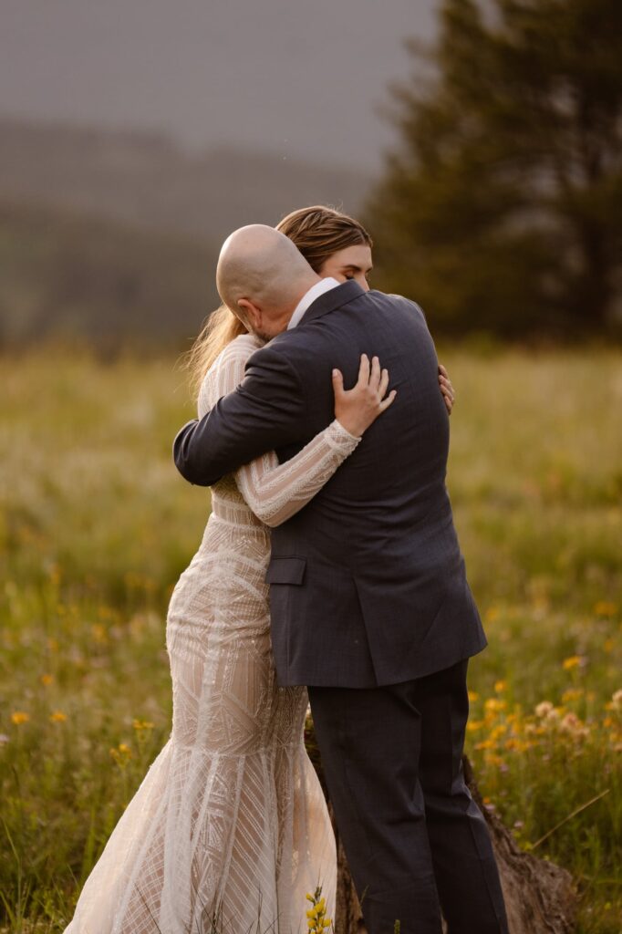 couple hugging after saying "I do"