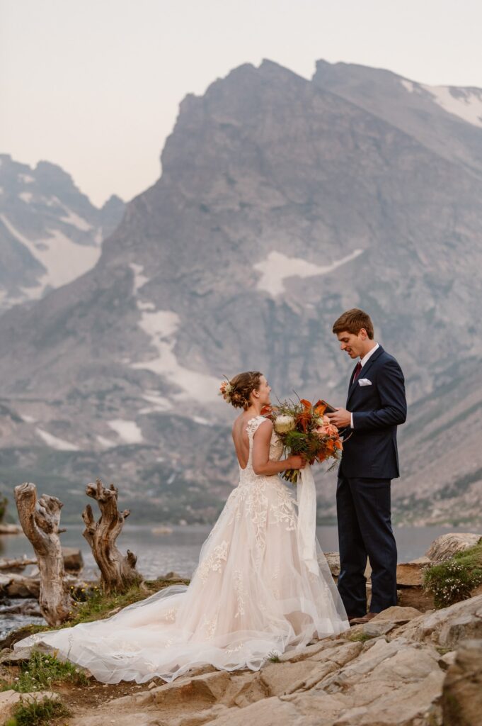 Couple eloping at a mountain lake