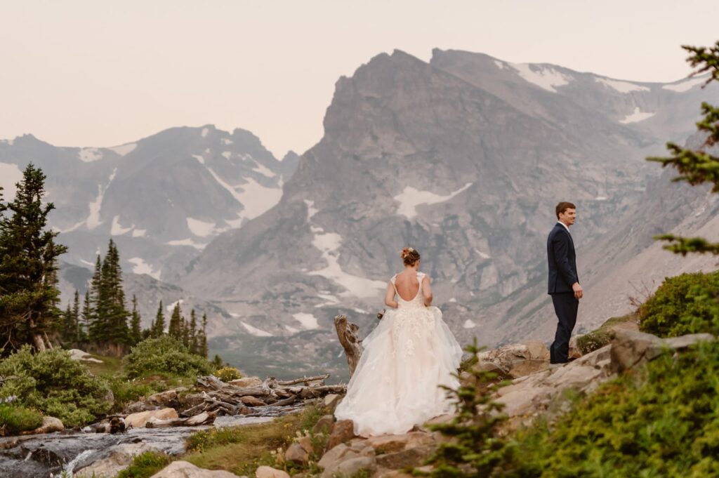 Couple having first look at Lake Isabelle elopement in Colorado 