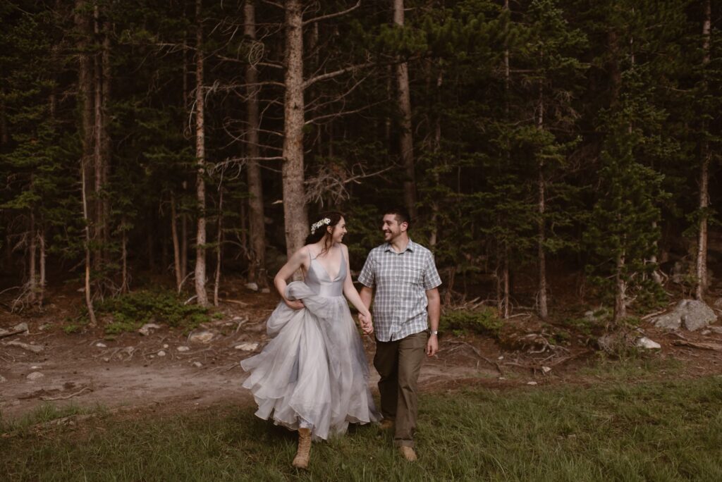 Couple hiking toward the camera in Rocky Mountain National Park