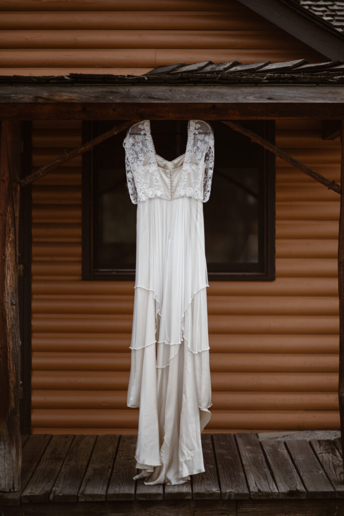Wedding dress hanging from the cabin roof