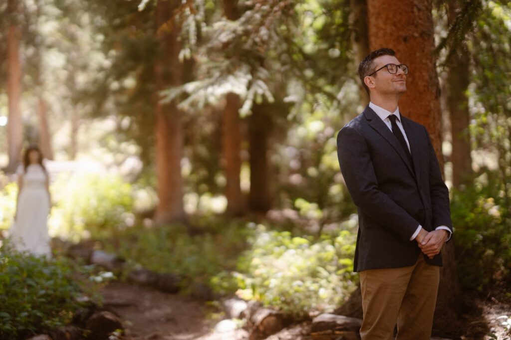First look in the forest during an adventure elopement