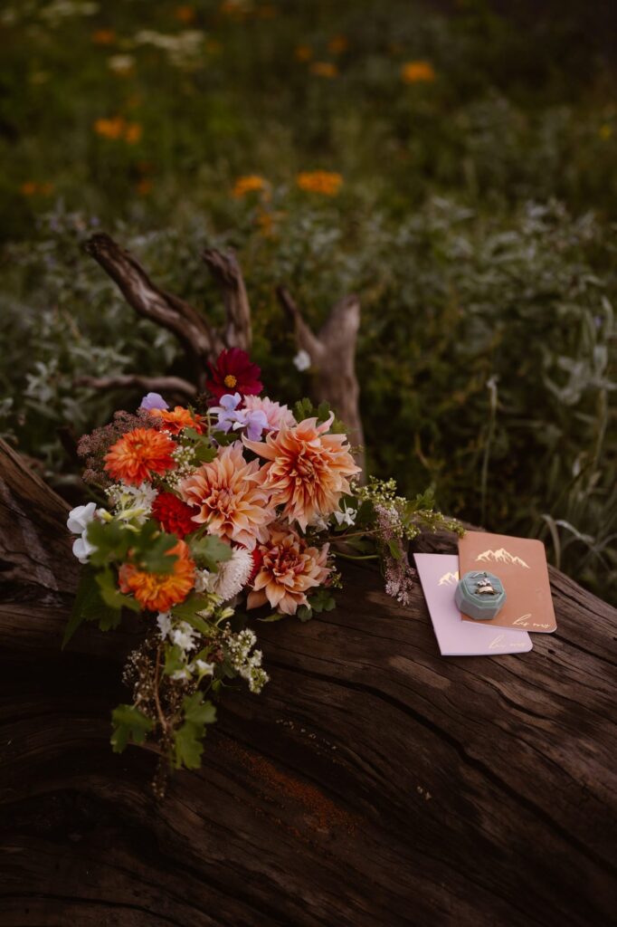 Wedding flowers with rings and vow books