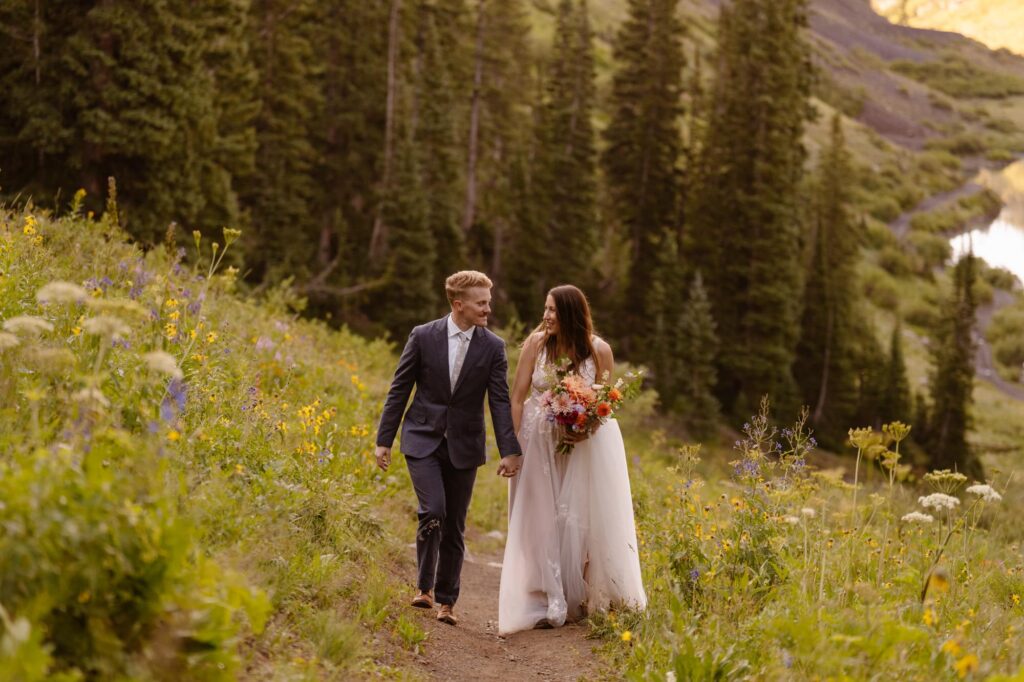 Bride and groom hiking in Crested Butte