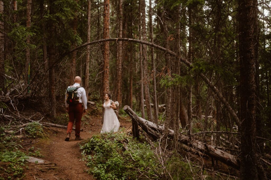 Couple standing under neat arched tree