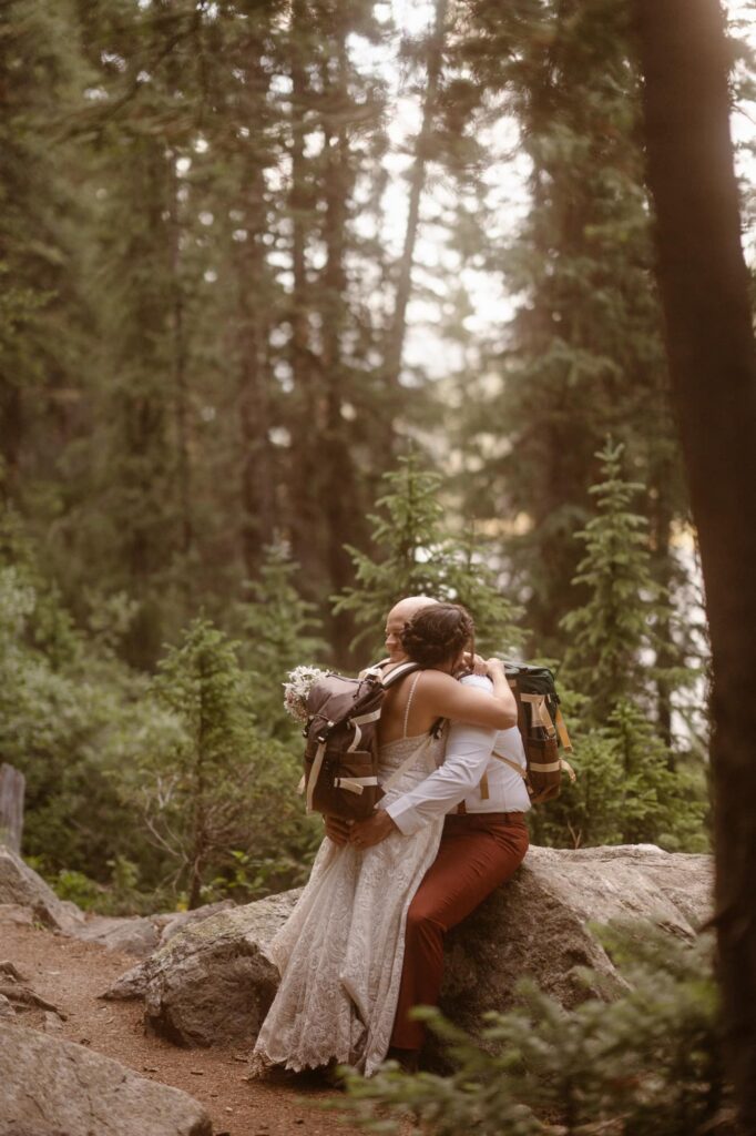 Couple hugging in the forest in Breckenridge, Colorado on their elopement day