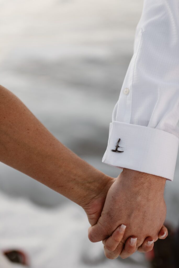 Ice axe cufflink detail on the groom