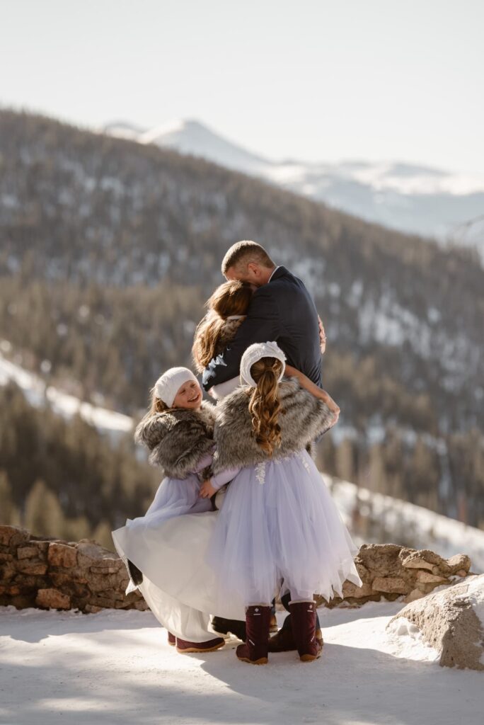 First kiss while kids celebrate and dance