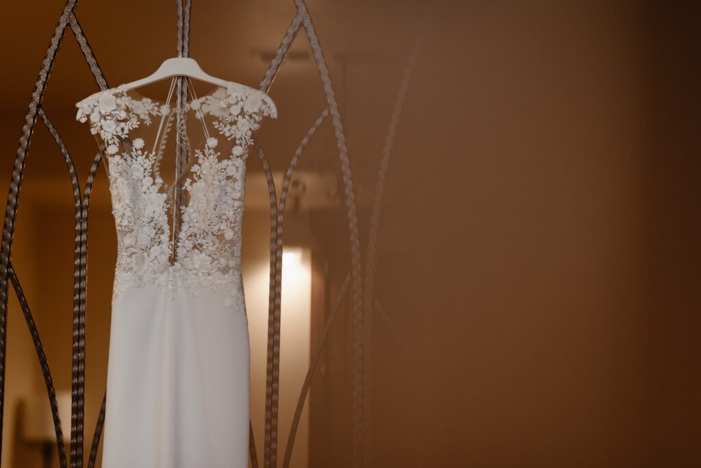 Dress hanging from a wine cellar