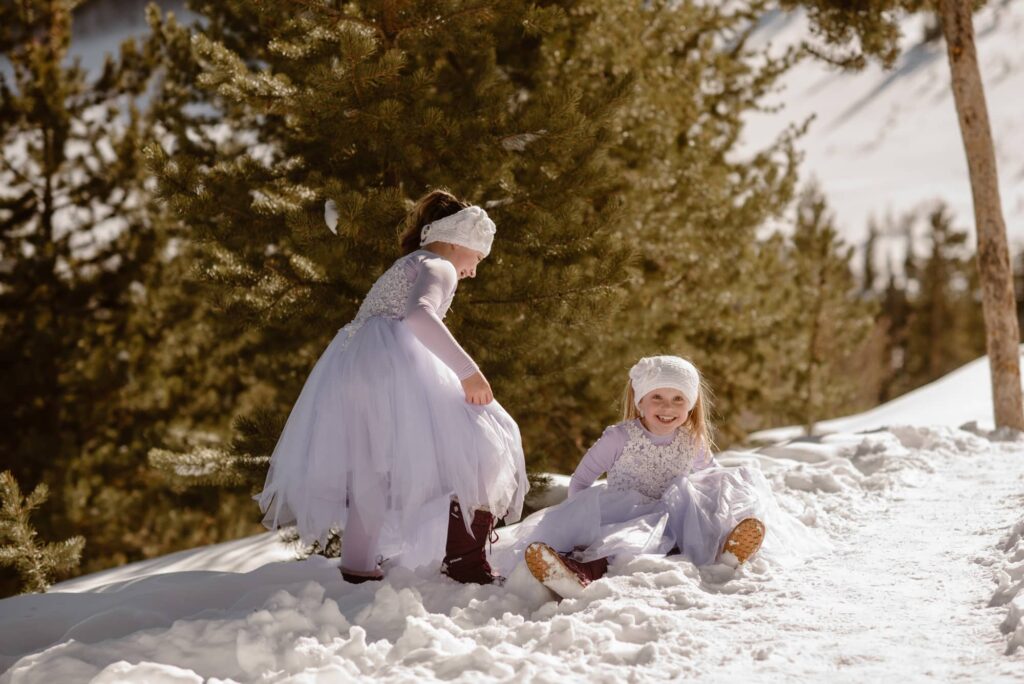 Girls being silly and playing in the snow