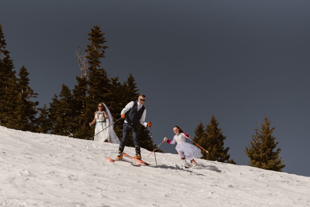 Downhill skiing on elopement day in wedding attire