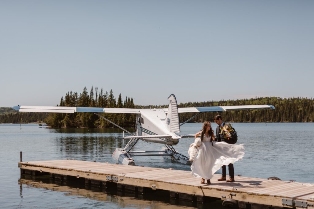 Bride getting her dress blown from the plane exhaust