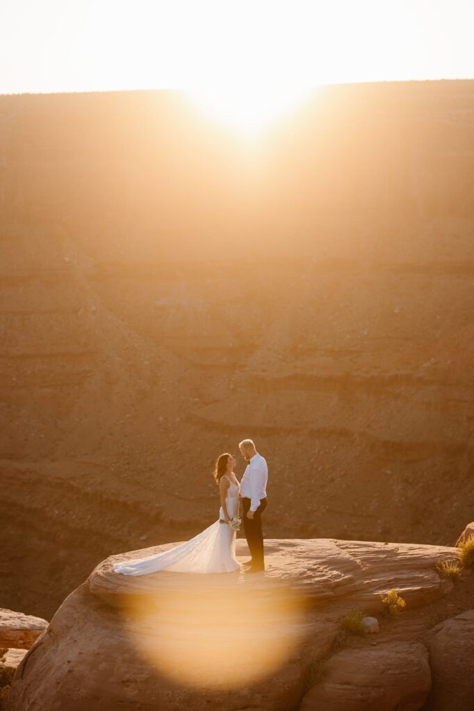 Couple soaking in the last bit of sunshine before sunset during their Moab adventure elopement