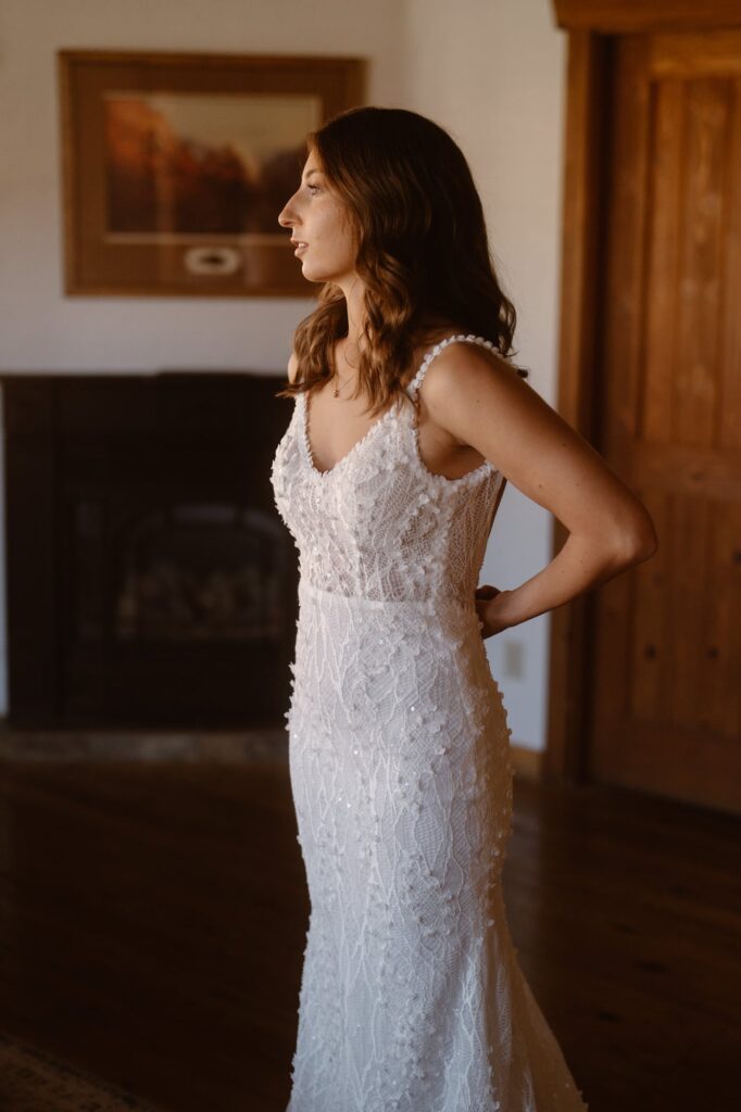 Bride putting on her elopement dress