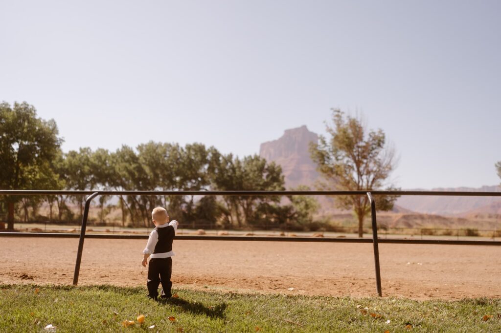 Son looking out on the horse stables