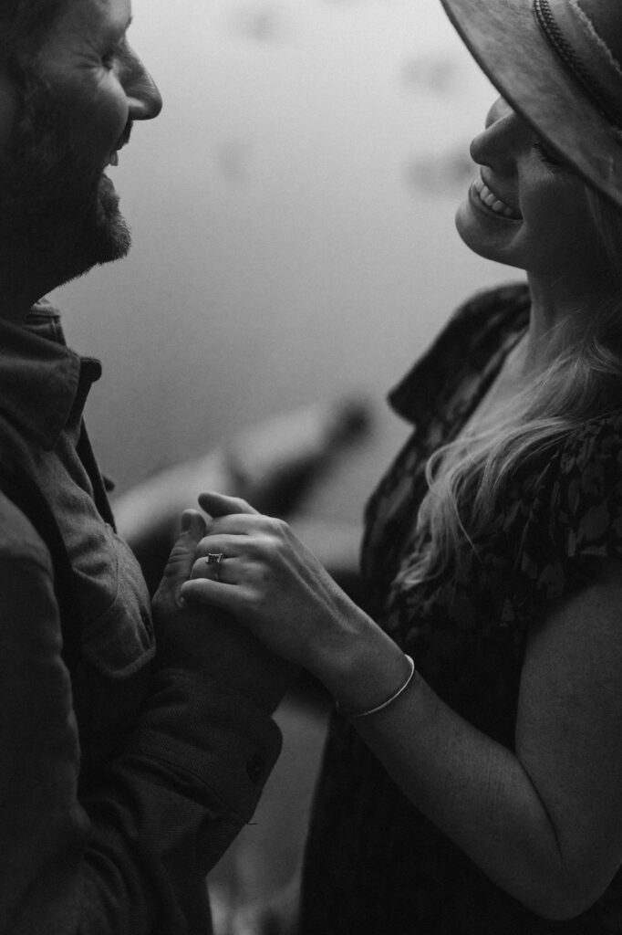 Black and white photo of couple holding hands