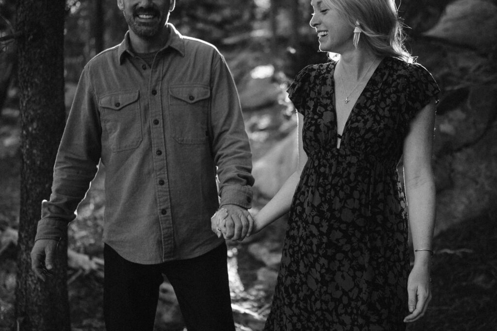 Black and white photo of couple holding hands