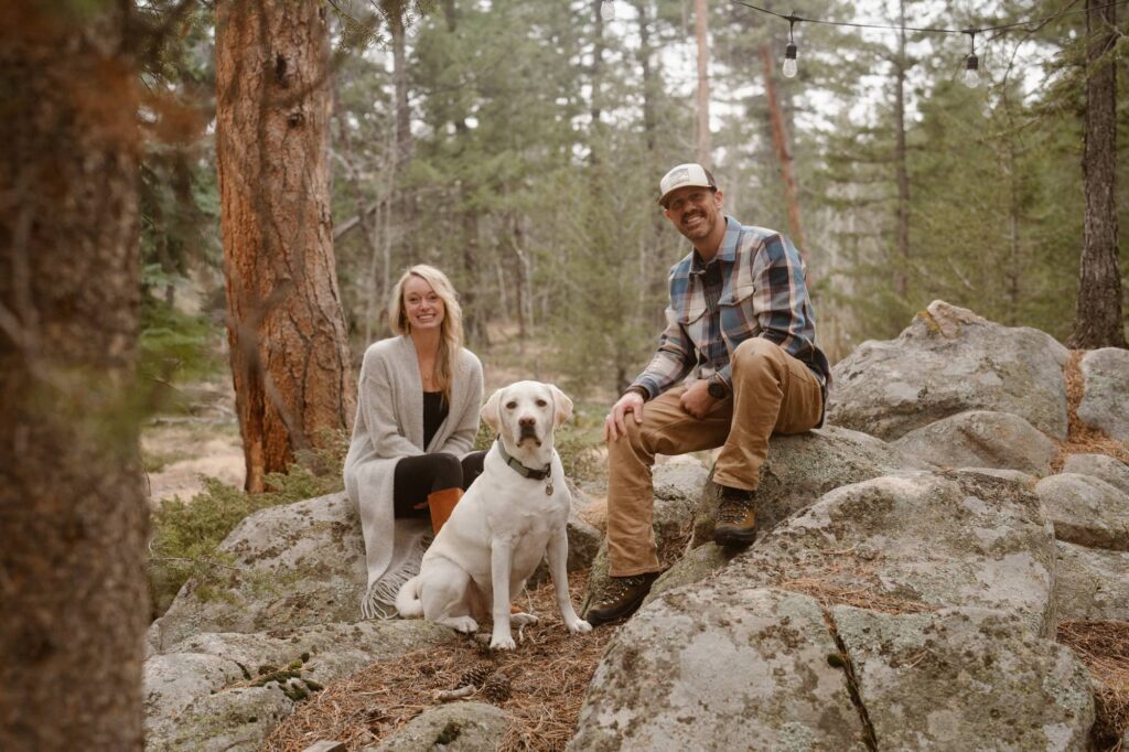 Couple with their dog in the mountains