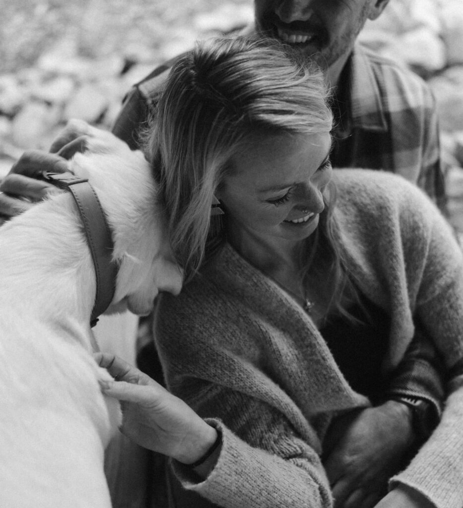 Engagement session snuggles with yellow lab