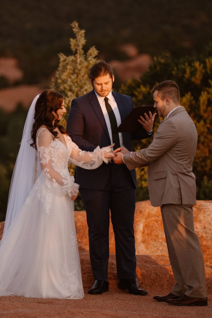 Ring exchange during Garden of the Gods wedding ceremony