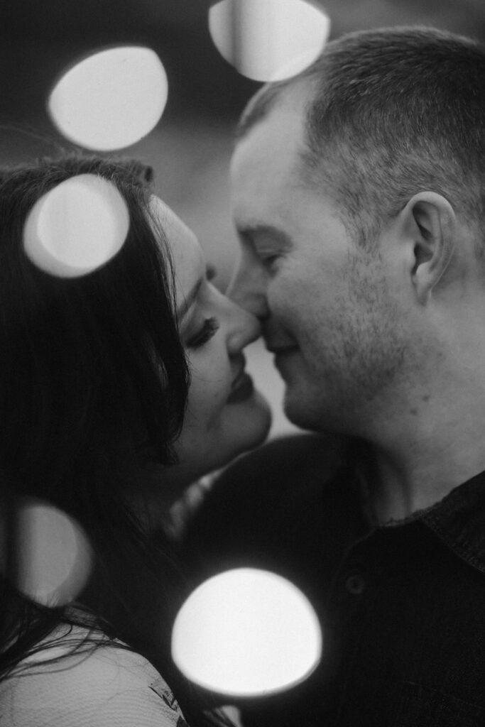 Couple kissing under the twinkling lights