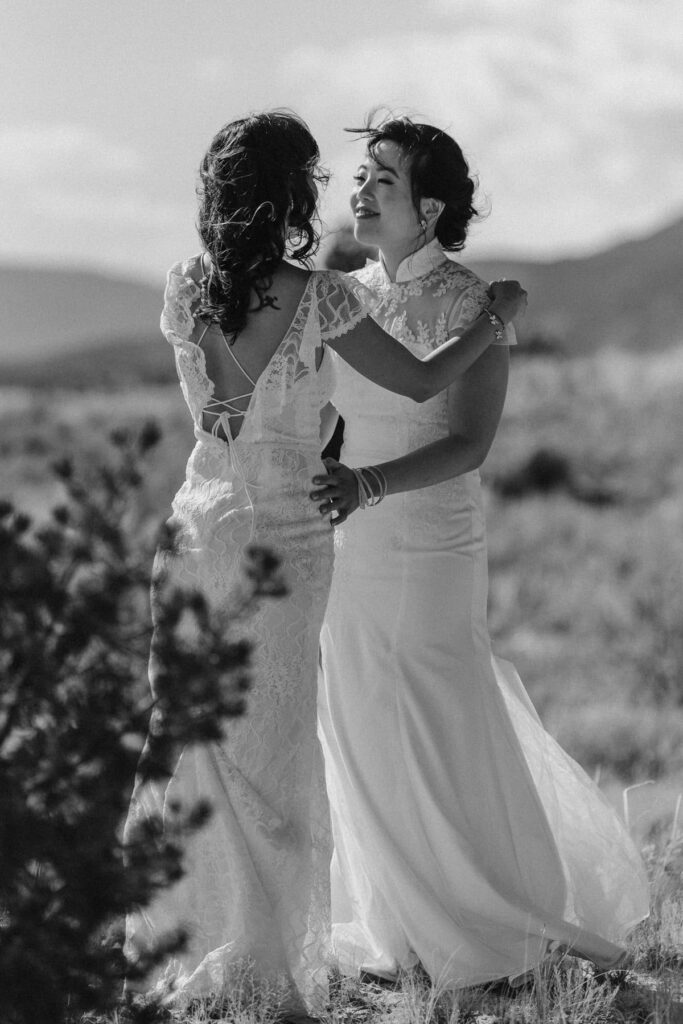 Couple hugging after wedding ceremony in the desert