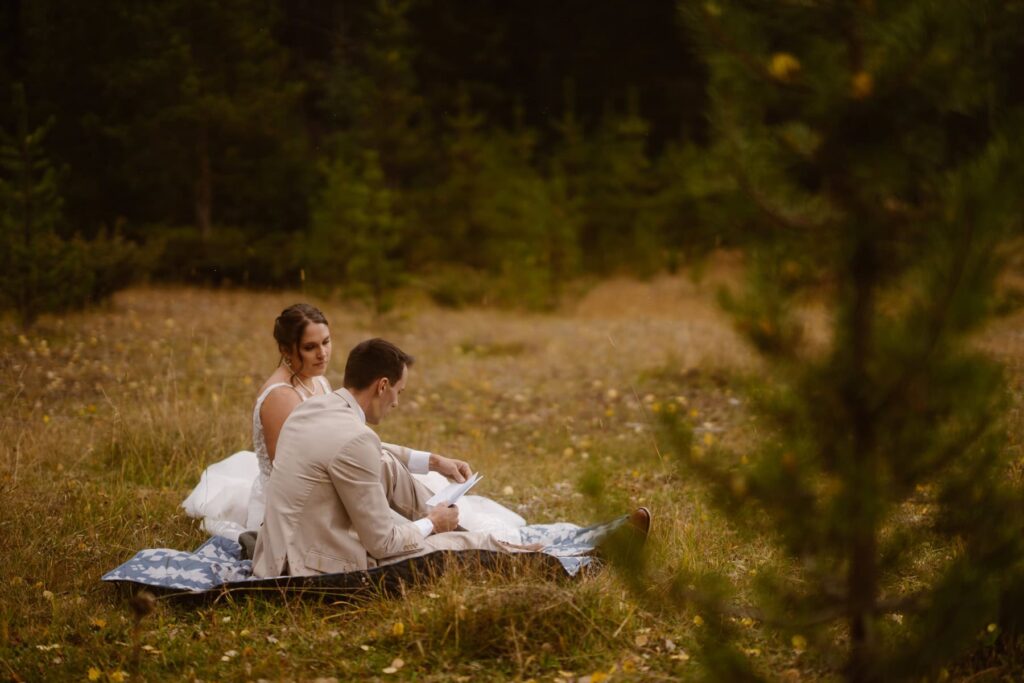 Couple reading a journal entry on their wedding day