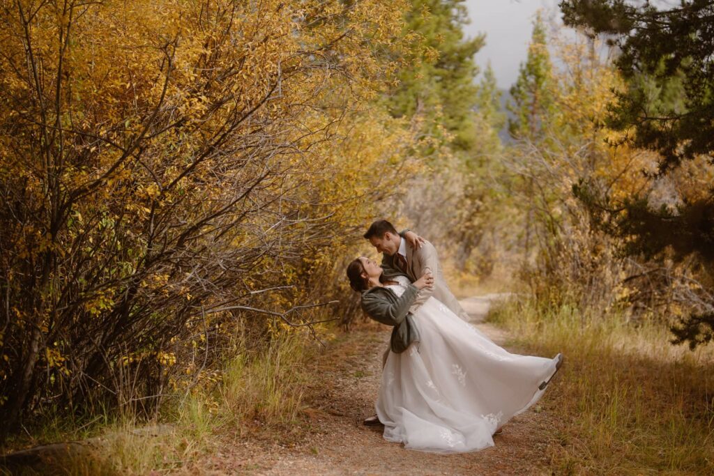 Bride and groom share first dip in the fall foliage