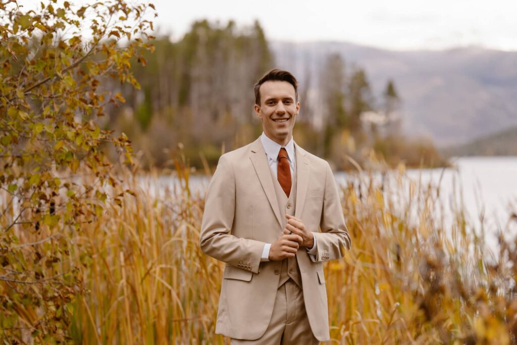 Groom smiling during portraits at Grand Lake, Colorado