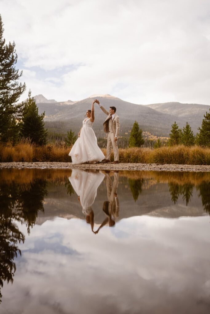 Wedding day dance along the river in the mountains