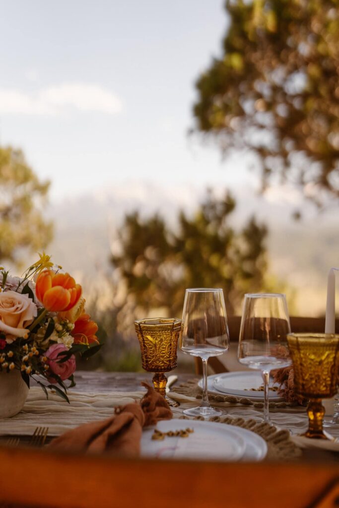 Outdoor wedding reception tablescape in the mountains