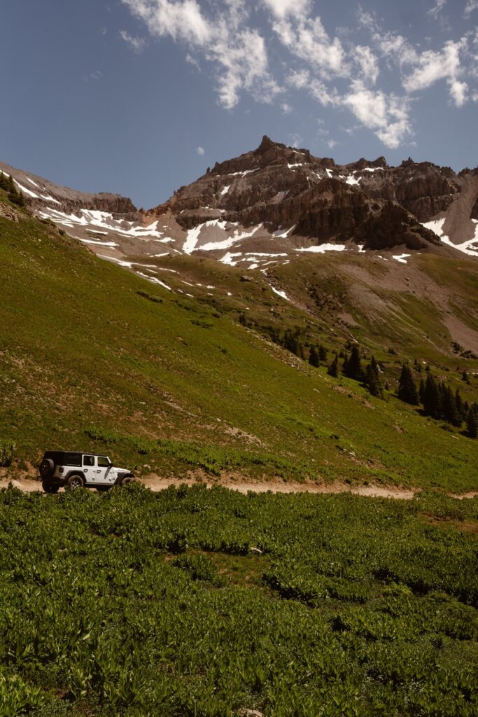 Jeep driving through the Colorado mountains