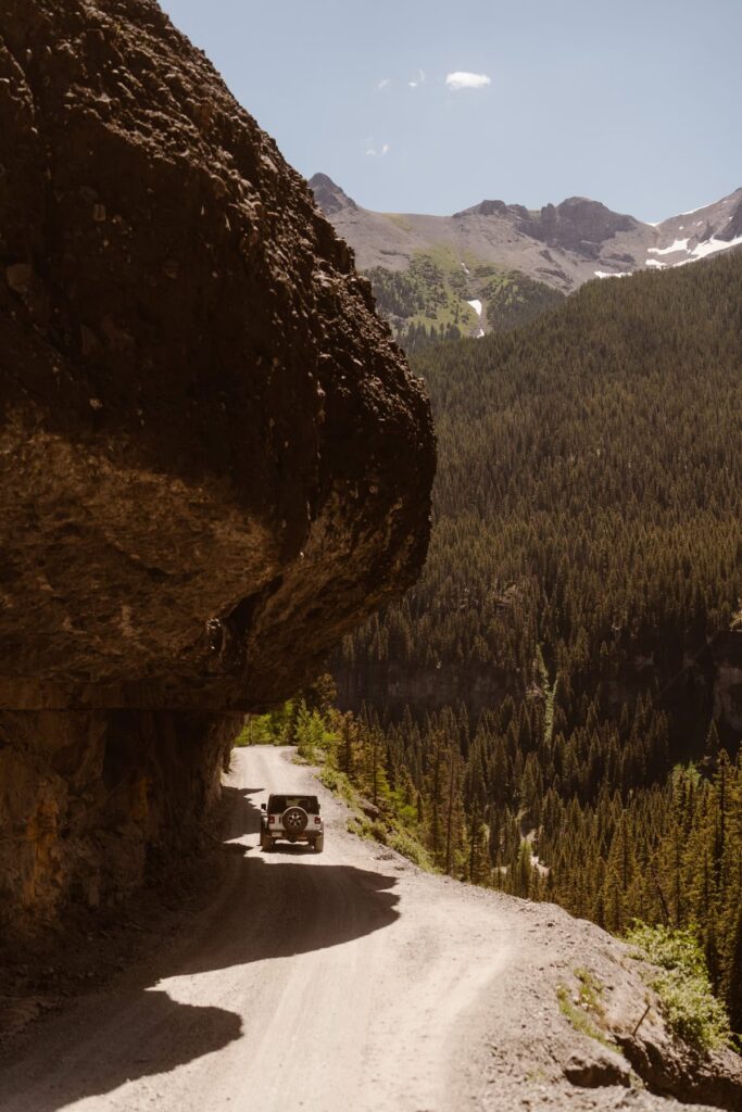 Jeep driving down a shelf road in Ouray