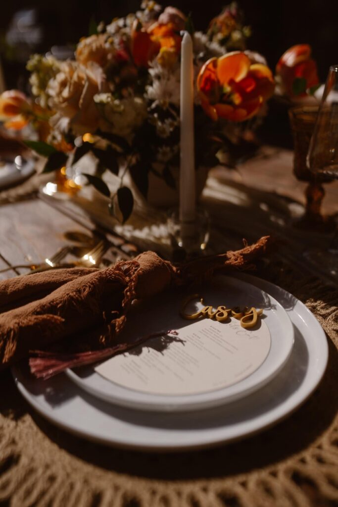 Plateware, candles, and flowers on tablescape