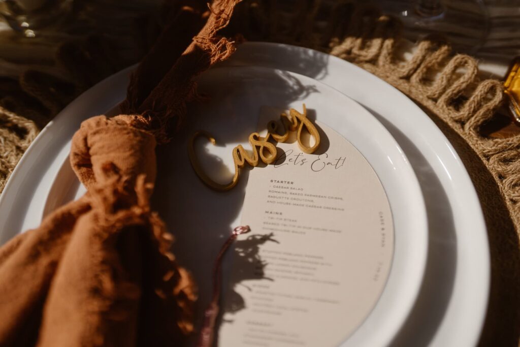 Plates and menu for outdoor intimate wedding celebration