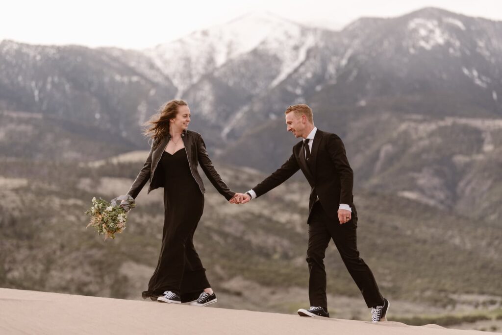 Couple eloping at Great Sand Dunes National Park in all black