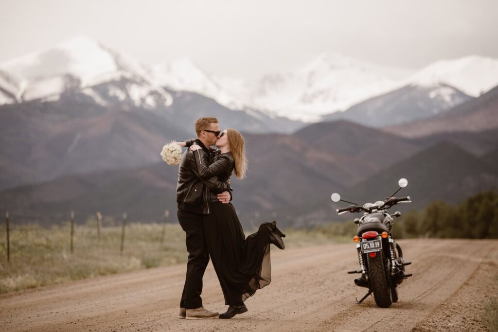 Couples portraits with a motorcycle in the mountains