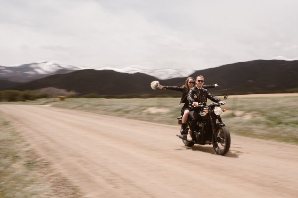 Motorcycle couple takes wedding photos in the mountains with their motorbike