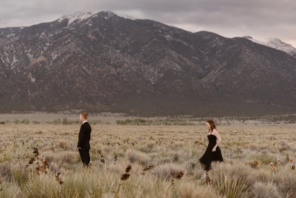 Couple sharing a first look in the mountains 