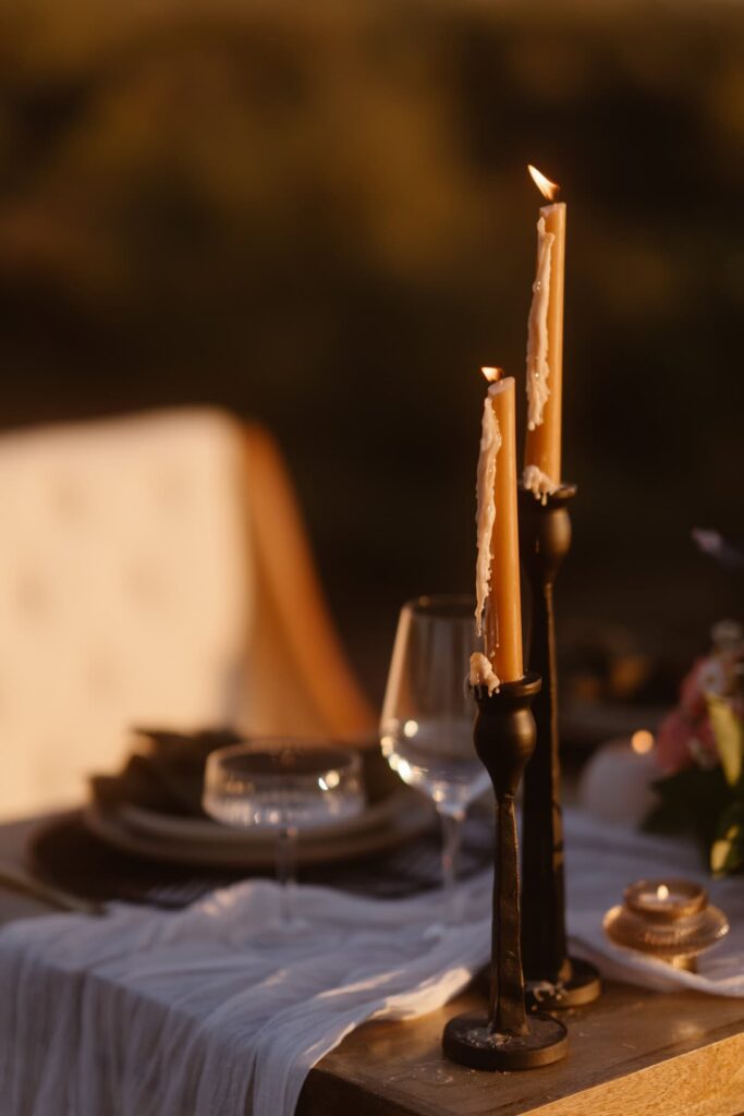 Candles dripping wax at romantic elopement dinner