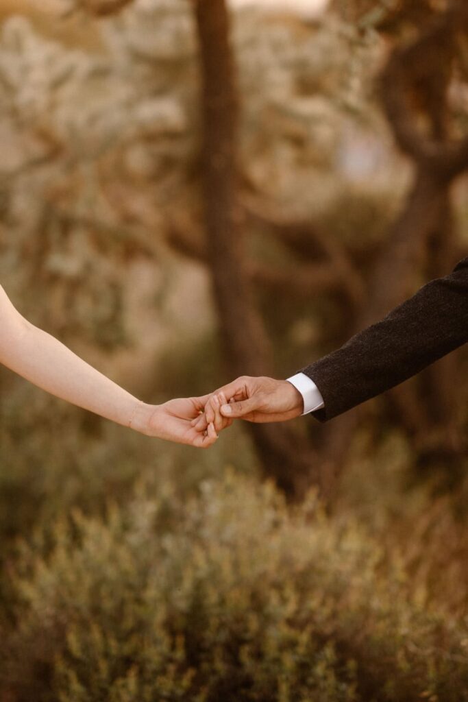 Bride and groom holding hands