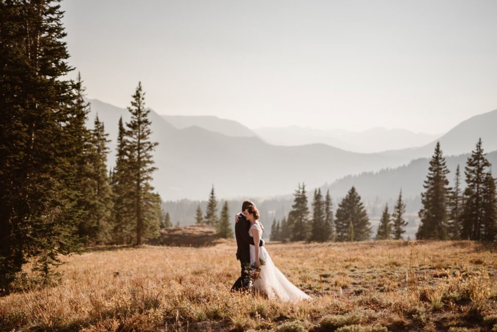 Bride and groom portraits in the Colorado mountains during the fall time