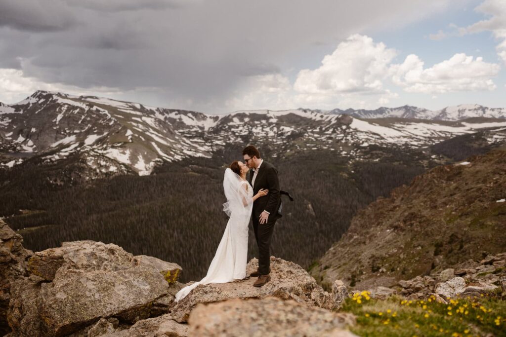 Wedding photos on a mountain cliff in Estes Park, Colorado