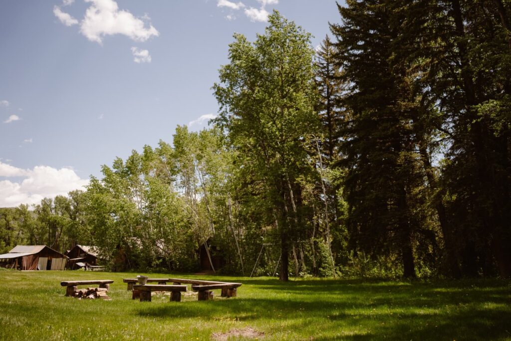 View of fire pit and swing set at Glen Eden Resort in Colorado