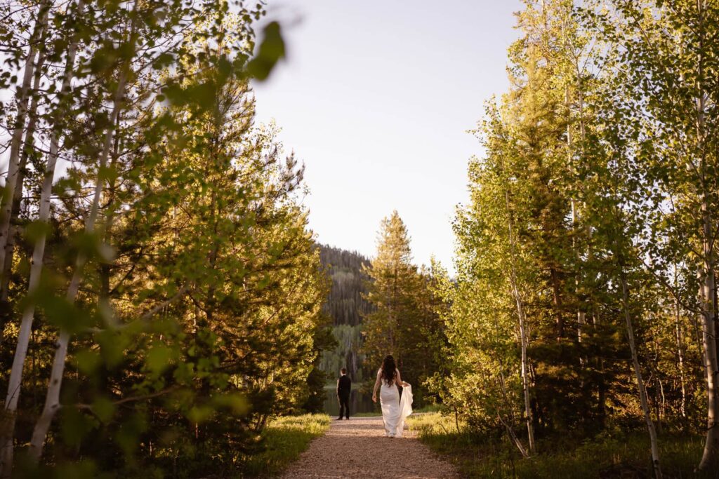 Couple sharing a wedding day first look at Pearl Lake near Steamboat Springs, CO