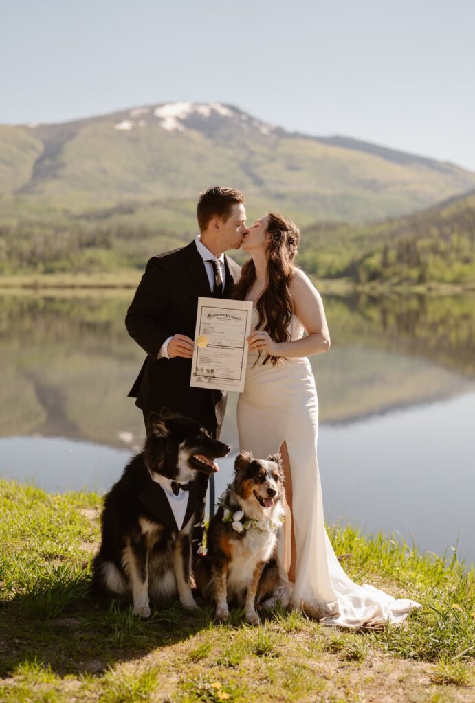 First kiss after signing the Colorado marriage license with their dog