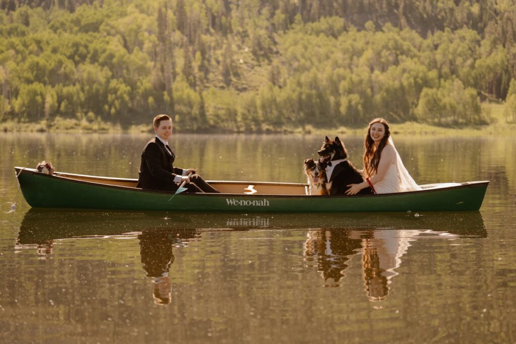 Wedding photos while canoeing with dogs