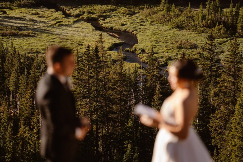 Bride and groom overlooking the river