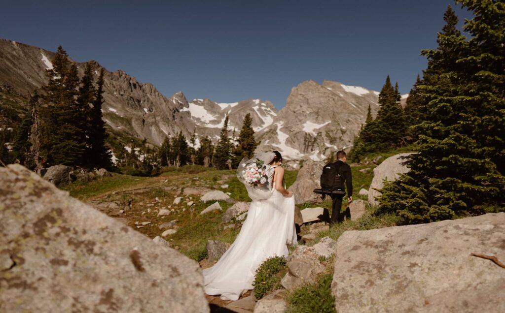 Bride and groom hiking